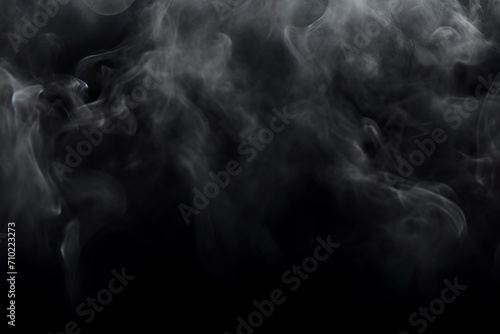 Hypnotic smoke patterns on dark abstract background in enigmatic atmosphere. Sinuous contours of smoke in nuances of shadows and reflections in a deep composition.