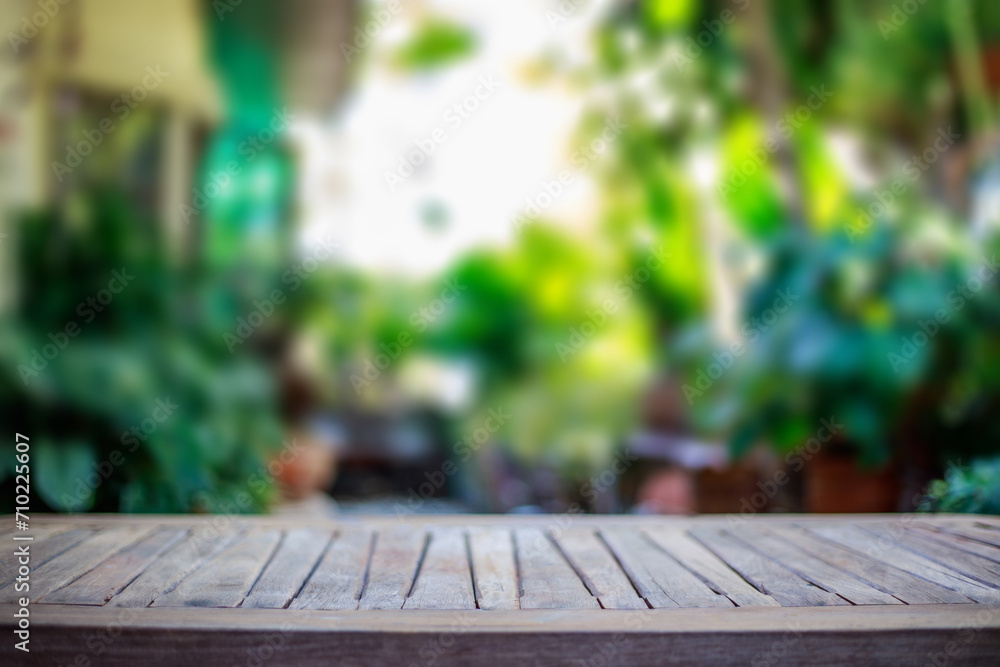 Empty wooden table top and blurred outdoor garden background. Empty wooden table space Empty wooden table for background. Empty wooden table top and blurred outdoor garden background. Empty wooden table space Empty wooden table for background.