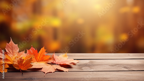 wooden table with orange fall autumn leaves beautiful background design