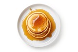Pancakes and maple syrup on white background from above
