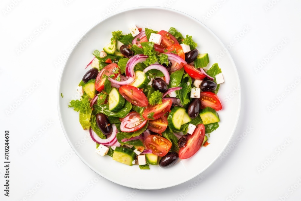 Top view of Greek salad on white background emphasizing nutrition Top view of Greek salad on white background emphasizing nutrition