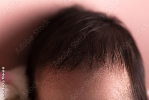 Top of newborn baby head with baby hair