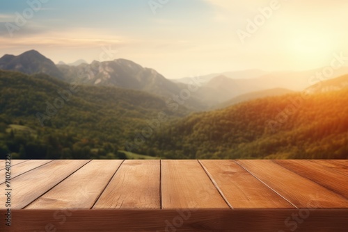 Warm orange or brown tones on a wooden table with a blurred mountain view in the morning or evening