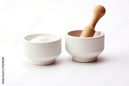 White mortar and pestles on a white background separated