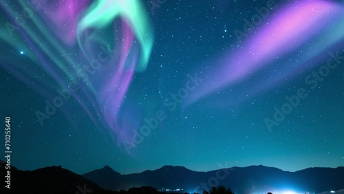 Aurora and Starry Sky Cosmic Nocturne Above Mountains Loop photo