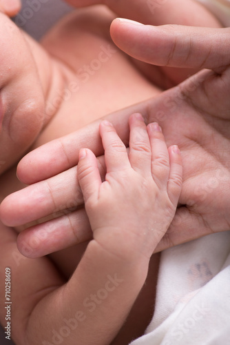 Newborn baby little hands body part affection motherhood