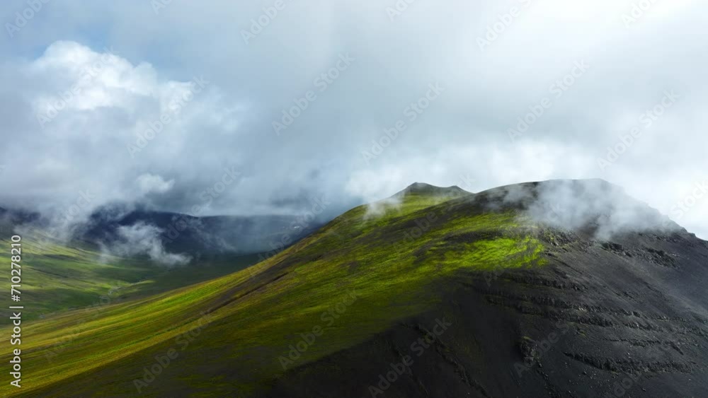 Flying Through Clouds Above Hills Cowered With Green Grass, Paradise Heaven Mountain Range With High Peaks, Wonderful Inspiring Natural Landscape. Iceland Nature.