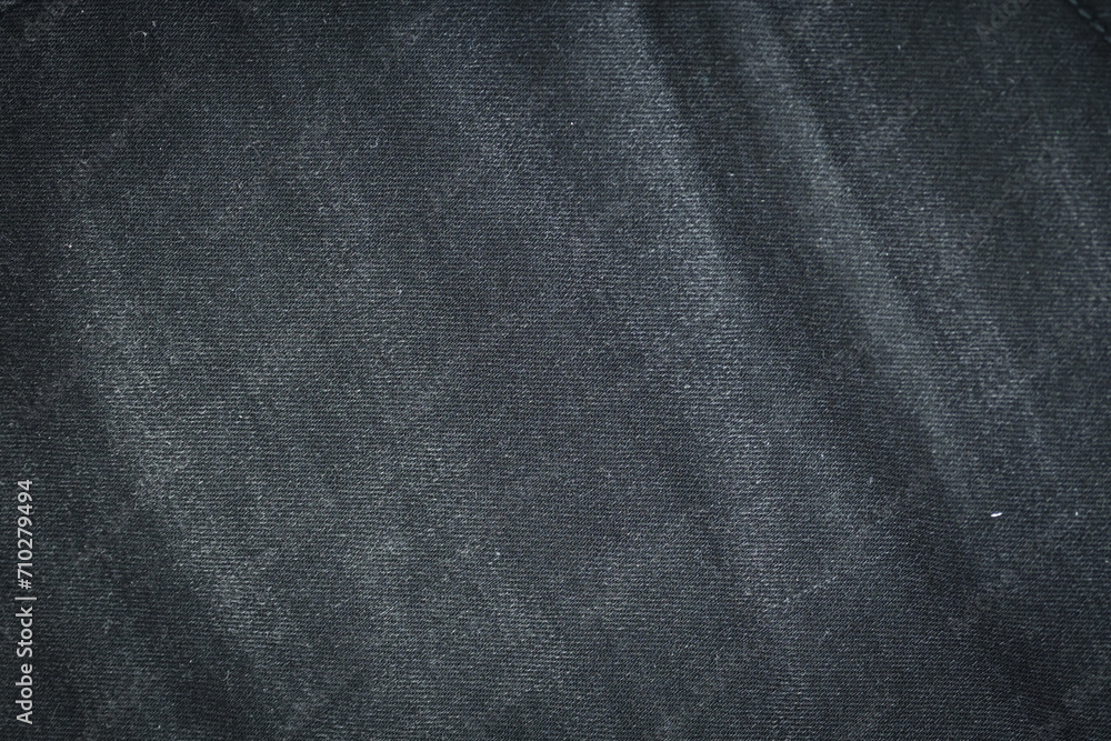 Fototapeta premium black denim clothing texture background, textile of pants fashion
