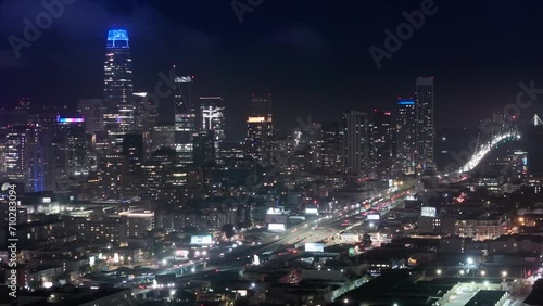 Wallpaper Mural Aerial flight over San Francisco city downtown illuminated at night. Night traffic aerial panorama 4K drone shot. San Francisco night evening buildings downtown skyline. Skyscrapers finance district Torontodigital.ca