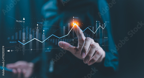 Businessman holding growth business graph progress ,startup business finance technology and investment trading trader investor.Stock Market Investments Funds and Digital Assets, graph financial data. photo