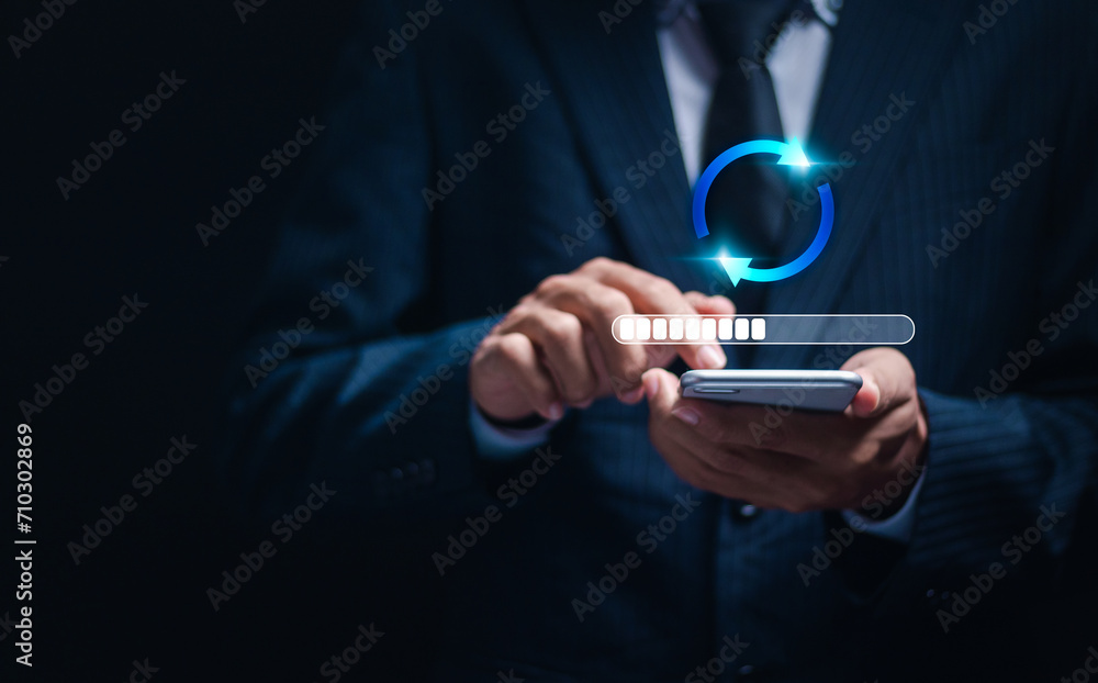 Software update or operating system upgrades to keep your device up to date with enhanced functionality in new versions and improved security. Person use smartphone with virtual installing update bar Software update or operating system upgrades to keep your device up to date with enhanced functionality in new versions and improved security. Person use smartphone with virtual installing update bar
