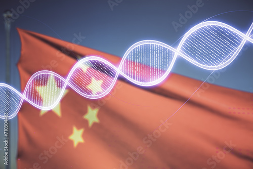 DNA hologram on Chinese flag and sunset sky background, science and biology concept. Multiexposure © Pixels Hunter
