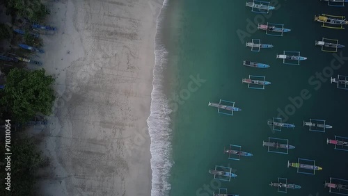 Aerial video of seaside view with fishing boats. several fishing boats were leaning on the beach. a combination of views of the sky, hills, beaches and surrounding nature. cinematic footage HD beach.