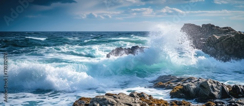 Crashing waves on rocks in the ocean. © AkuAku