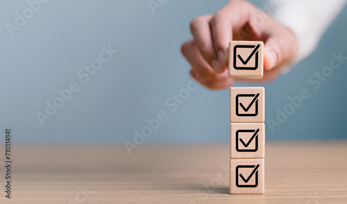 Checklist concept, business person checklist tick answer sign in checkbox, validation online questionnaire quality control document, man use pen to tick correct sign mark in checkbox form.