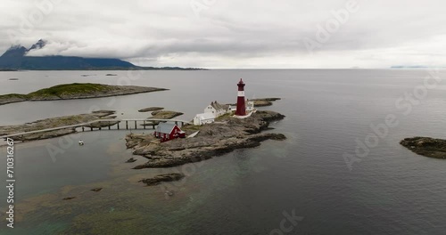 Tranoy Lighthouse - Scenic Landmark On Vestfjorden In Hamaroy, Norway. aerial shot photo
