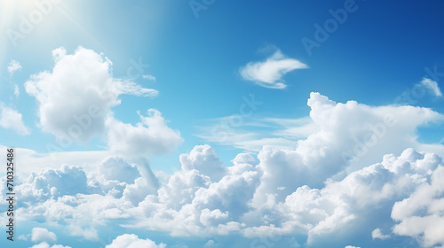 blue sky with bright sunlight and white clouds background
