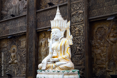 White Buddha statue at Gangaramaya Temple, it is one of the most important temples in Colombo © evannovostro