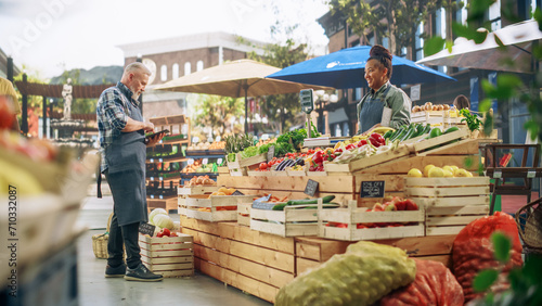 Photography Multiethnic Small Business Owners Selling a Selection of Ecological Fruits and Vegetables at an Outdoors Farmers Market