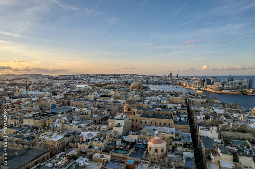 Aerial beautiful drone view of sunset in Valletta old harbour, Malta