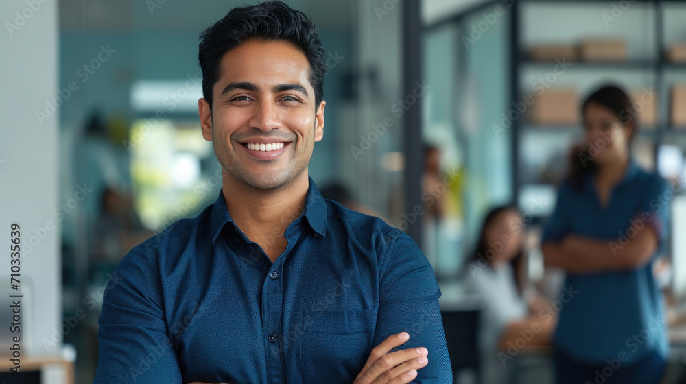 Portrait of a handsome smiling asian indian businessman boss standing in his modern business company office. - obrazy, fototapety, plakaty 