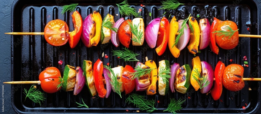Vegetable skewers with tomatoes, radishes, peppers, onions, and dill on a grill pan.