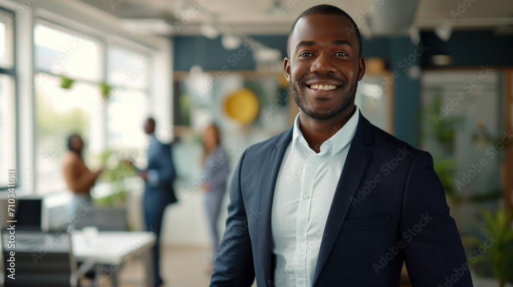 Portrait of a handsome smiling black businessman boss standing in his modern business company office. Portrait of a handsome smiling black businessman boss standing in his modern business company office.