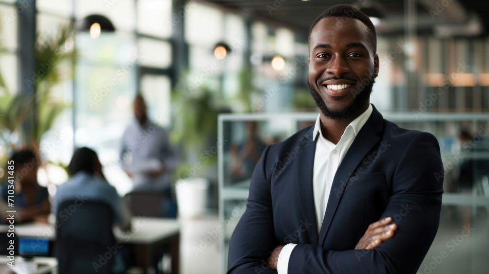 Portrait of a handsome smiling black businessman boss standing in his modern business company office. Portrait of a handsome smiling black businessman boss standing in his modern business company office.