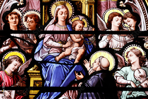 Saint Leonard church.  Stained glass. Saint Dominic receiving the Rosary from the Virgin Honfleur. France. photo