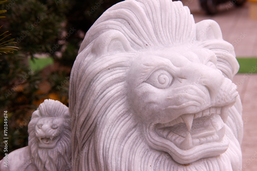 Phuoc Hue buddhist pagoda. Marble lion guardian at the entrance of the temple. Vietnam.