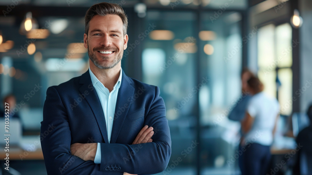 © Farnaces - Portrait of a handsome smiling businessman boss standing in his modern business company office. © Farnaces - Portrait of a handsome smiling businessman boss standing in his modern business company office.