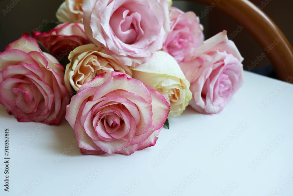 Fototapeta premium postcard layout. bouquet of pink roses and white blank for text