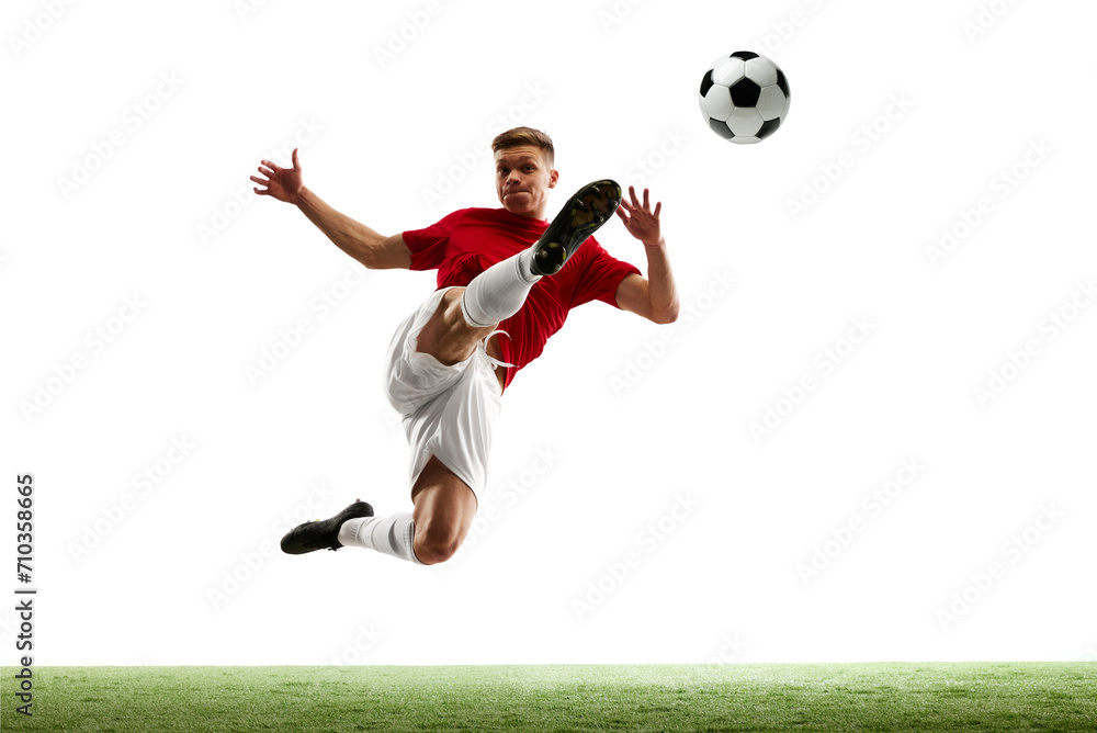 Soccer's aerial ballet. Balletic world of soccer. Skilled athlete executes elegant mid-air pass against white studio background. Concept of sport games, hobby, energy, world cup season, movement. Ad