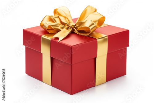 Red gift box with golden gift bow on white background © Ekaterina
