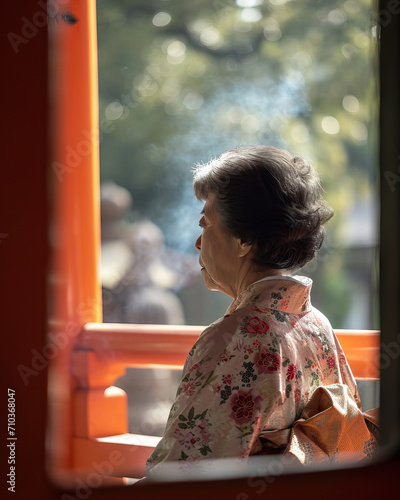 Elderly woman in traditional kimono at a Kyoto shrine, capturing the serene essence of Japanese culture and heritage in the peaceful morning light