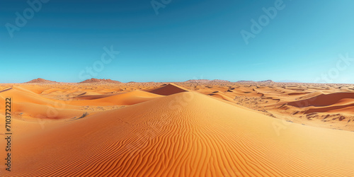 Die Sahara-Wüste mit Sanddünen und klarem Himmel photo