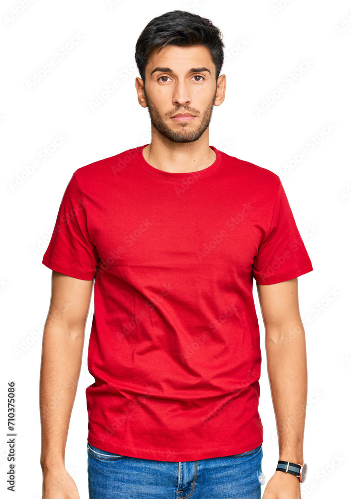 Young handsome man wearing casual red tshirt looking sleepy and tired, exhausted for fatigue and hangover, lazy eyes in the morning. Young handsome man wearing casual red tshirt looking sleepy and tired, exhausted for fatigue and hangover, lazy eyes in the morning.