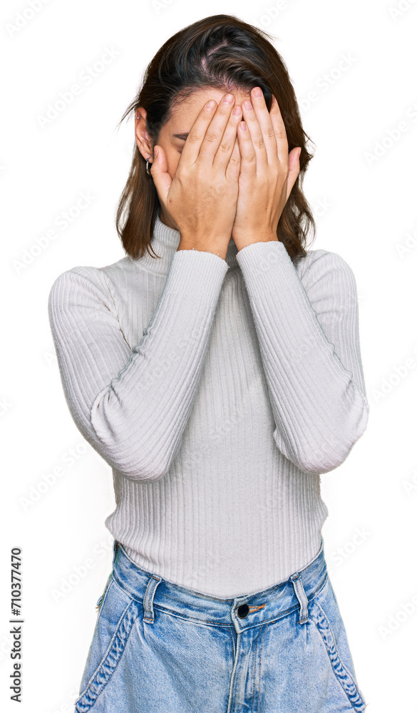 Young caucasian girl wearing casual clothes with sad expression covering face with hands while crying. depression concept. Young caucasian girl wearing casual clothes with sad expression covering face with hands while crying. depression concept.