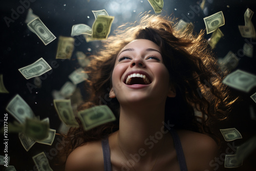 a happy woman with money flying in the air © toonsteb