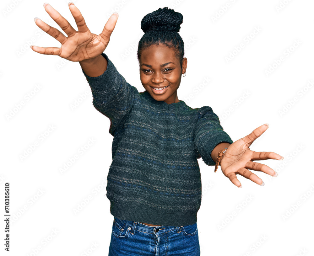Young african american woman wearing casual clothes looking at the camera smiling with open arms for hug. cheerful expression embracing happiness. - obrazy, fototapety, plakaty 