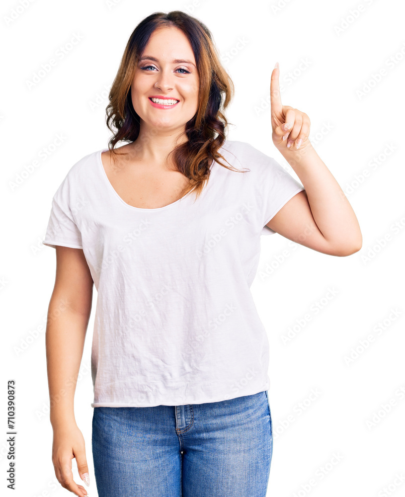Young beautiful caucasian woman wearing casual white tshirt showing and pointing up with finger number one while smiling confident and happy. Young beautiful caucasian woman wearing casual white tshirt showing and pointing up with finger number one while smiling confident and happy.