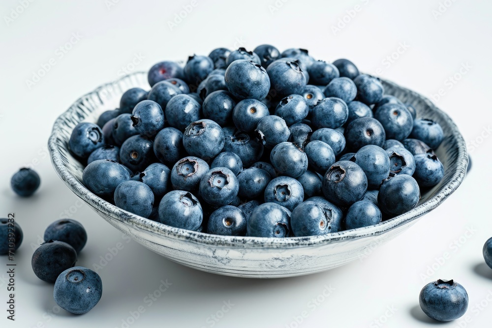 Freshly picked blueberries, isolated on a white ceramic plate background Freshly picked blueberries, isolated on a white ceramic plate background