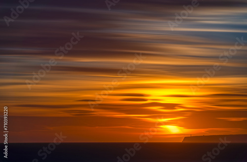 Long Exposure at Dusk with Lighthouse Overlooking Cliffs and Sea © F.C.G.