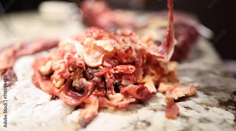 Closeup of substandard meat scraps for animal feed production. Deboning of meat concept Closeup of substandard meat scraps for animal feed production. Deboning of meat concept