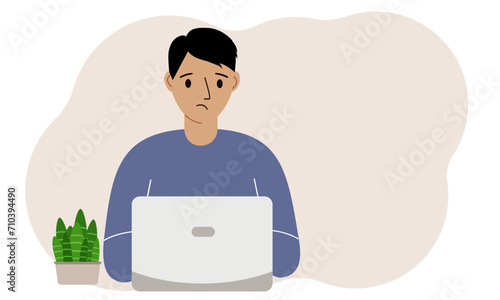 A man is working or studying at a laptop. Freelancing or distance learning and work concept.