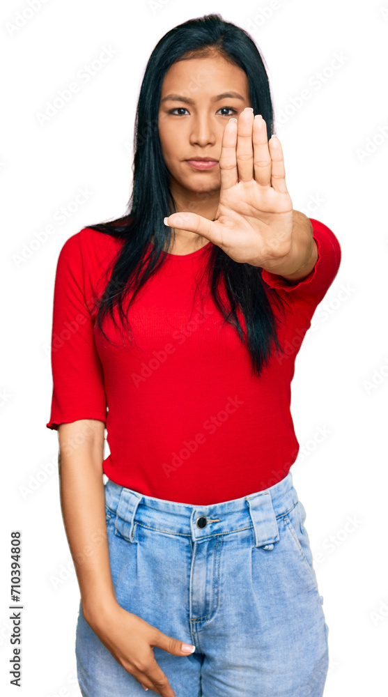Beautiful hispanic woman wearing casual clothes doing stop sing with palm of the hand. warning expression with negative and serious gesture on the face. Beautiful hispanic woman wearing casual clothes doing stop sing with palm of the hand. warning expression with negative and serious gesture on the face.
