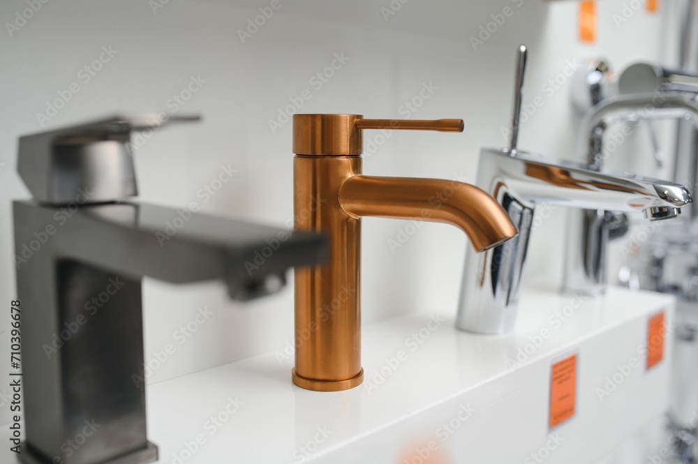 Rows of new faucets in plumbing shop Rows of new faucets in plumbing shop