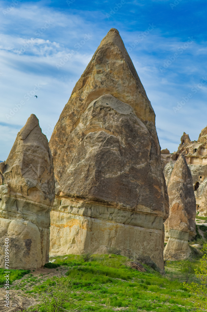 Typical Cappadocia landscape soft volcanic rock, shaped by erosion in Goreme, Turkey.