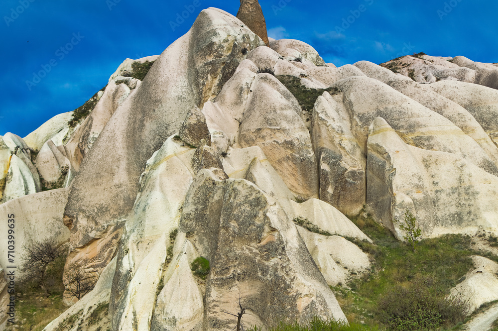 Typical Cappadocia landscape soft volcanic rock, shaped by erosion in Goreme, Turkey.