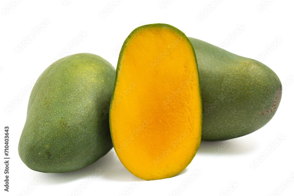 Half cut and two whole fresh organic green mango delicious fruit side view isolated on white background clipping path Half cut and two whole fresh organic green mango delicious fruit side view isolated on white background clipping path